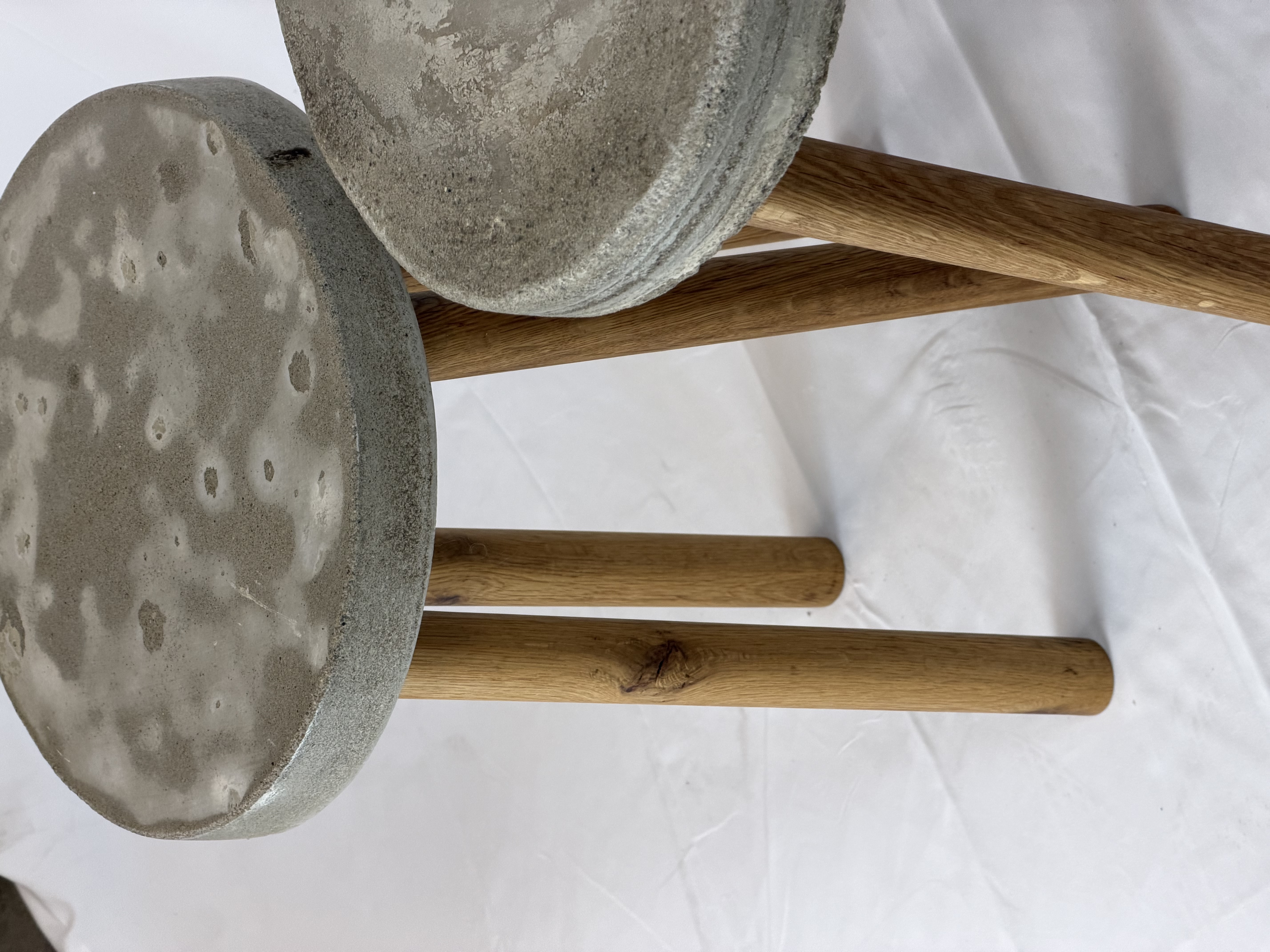 Detail shot of solid oak legs joined into thick cast concrete discs