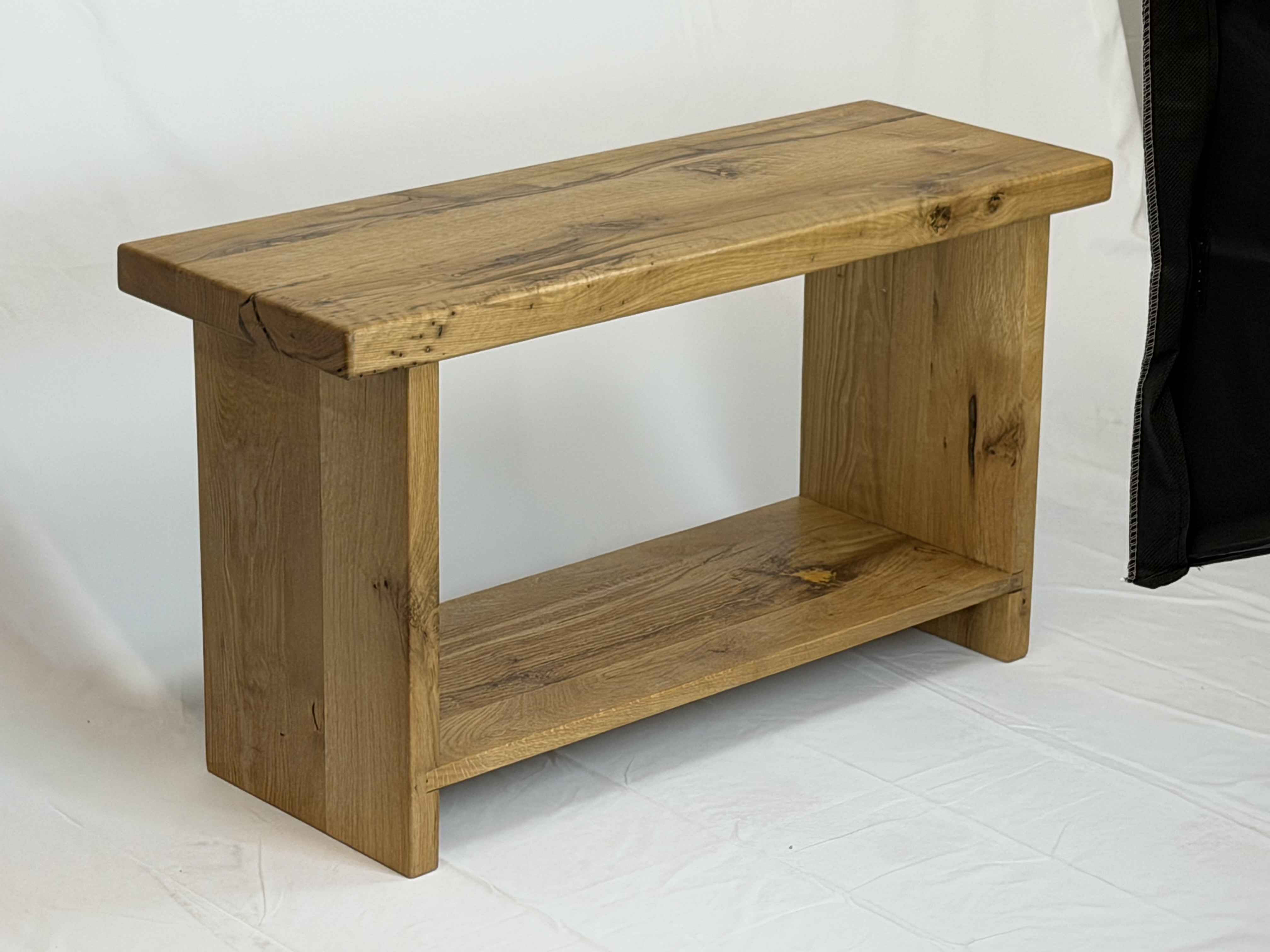 Three-quarters perspective showcasing solid leg panel joinery