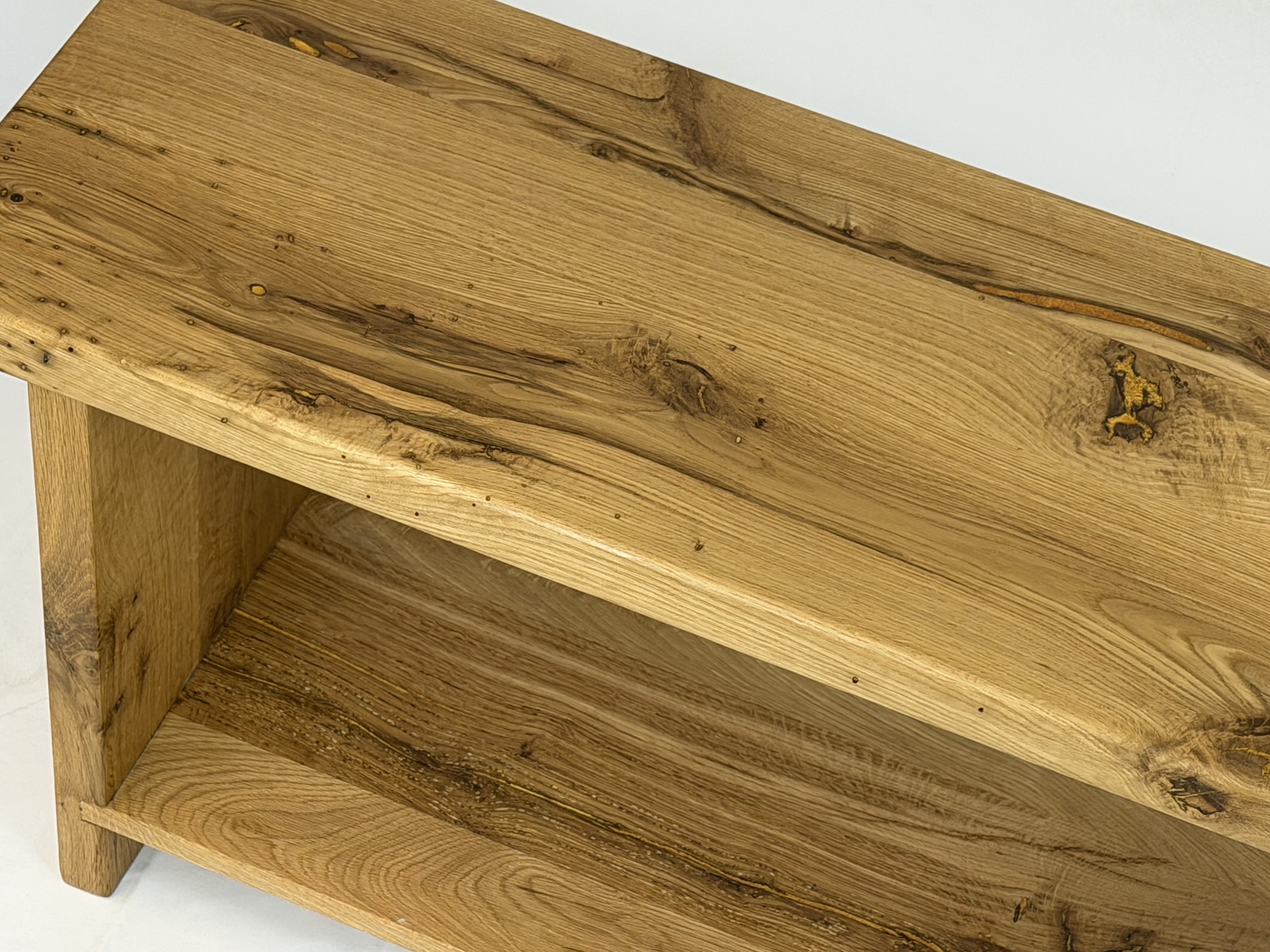 Detail shot of lower storage shelf joinery and timber texture