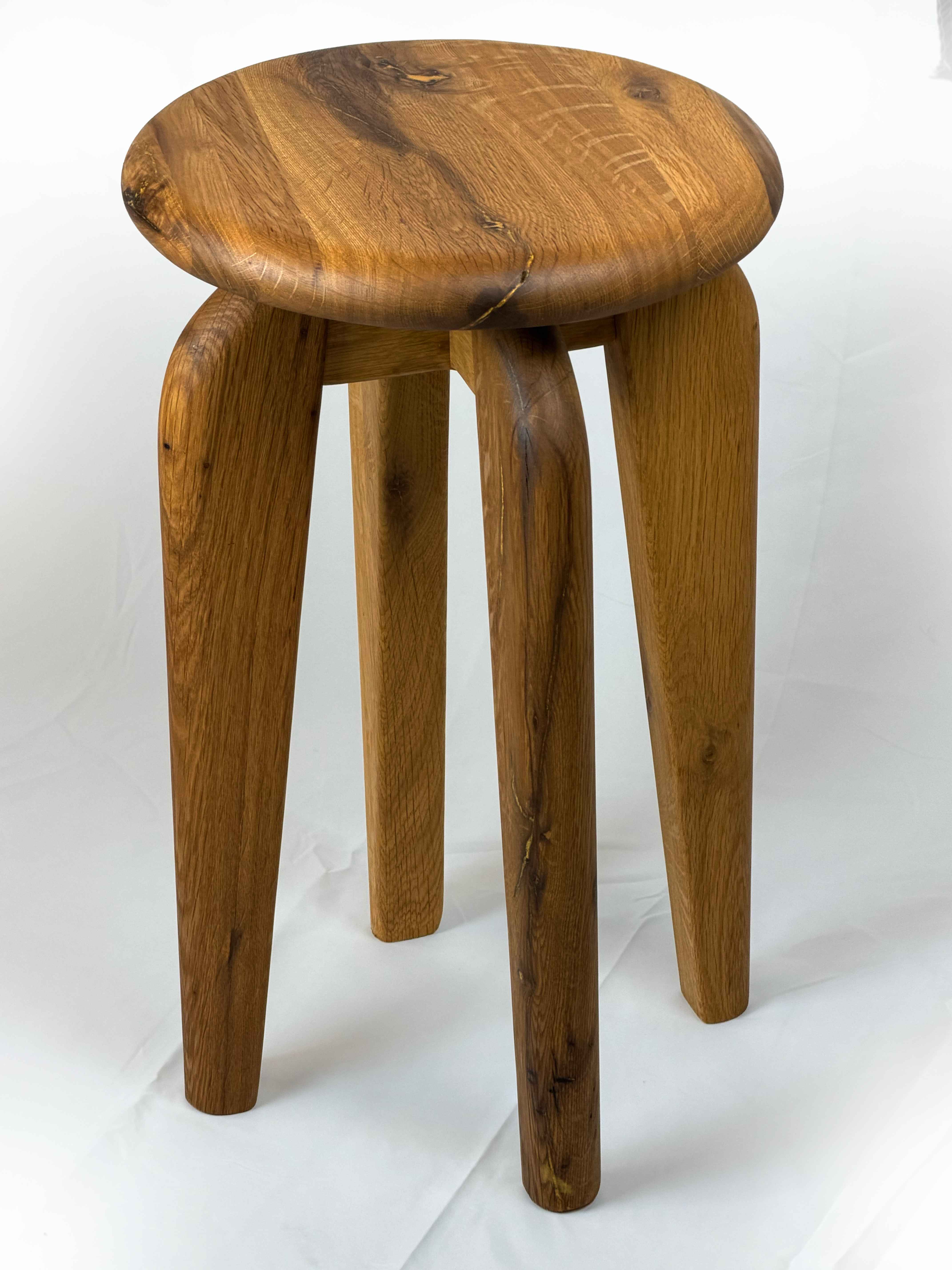 Full perspective view showing overall form and warm natural oak tones