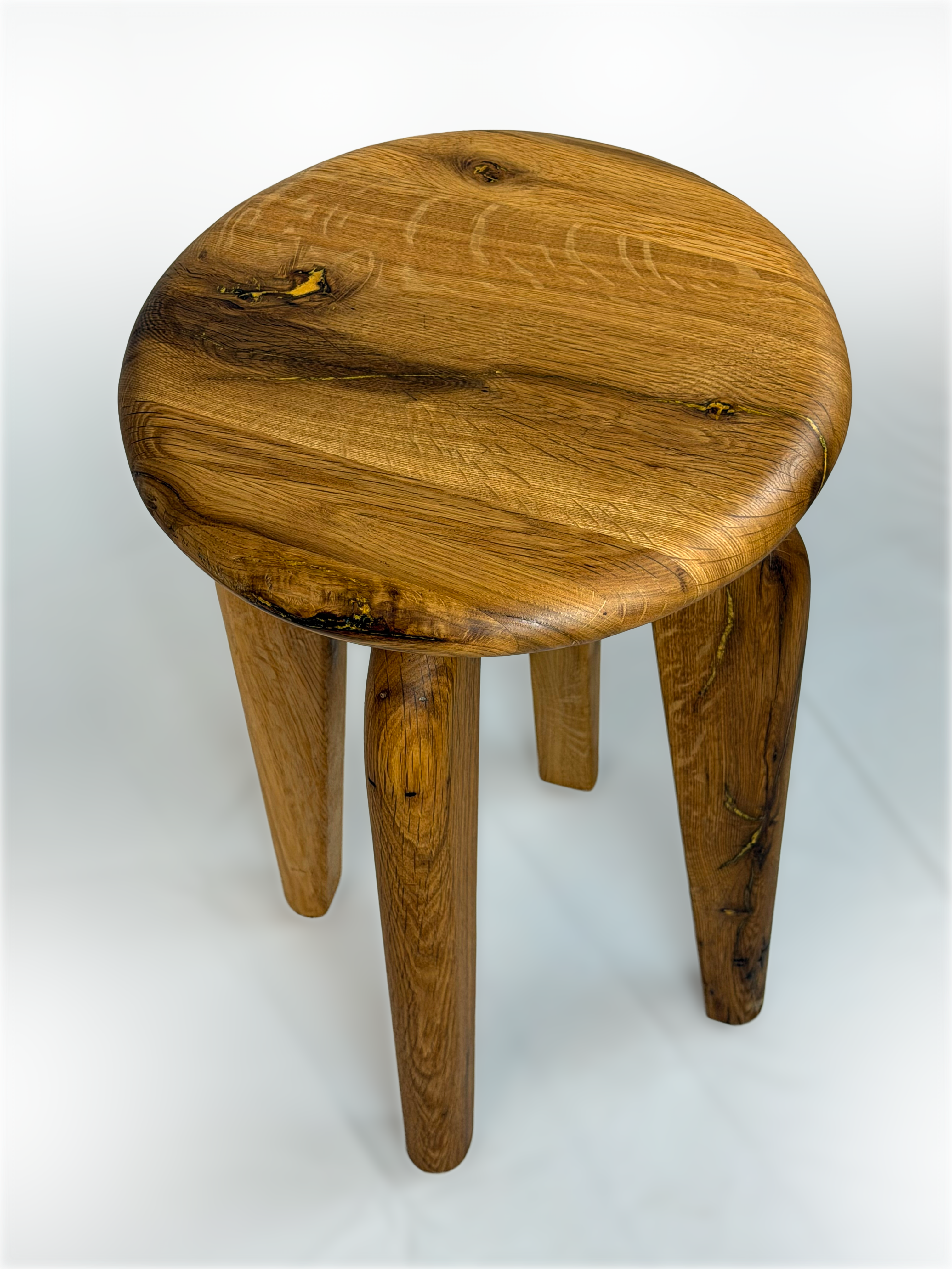 Top-down view highlighting natural oak grain fissures filled with hand-poured brass resin